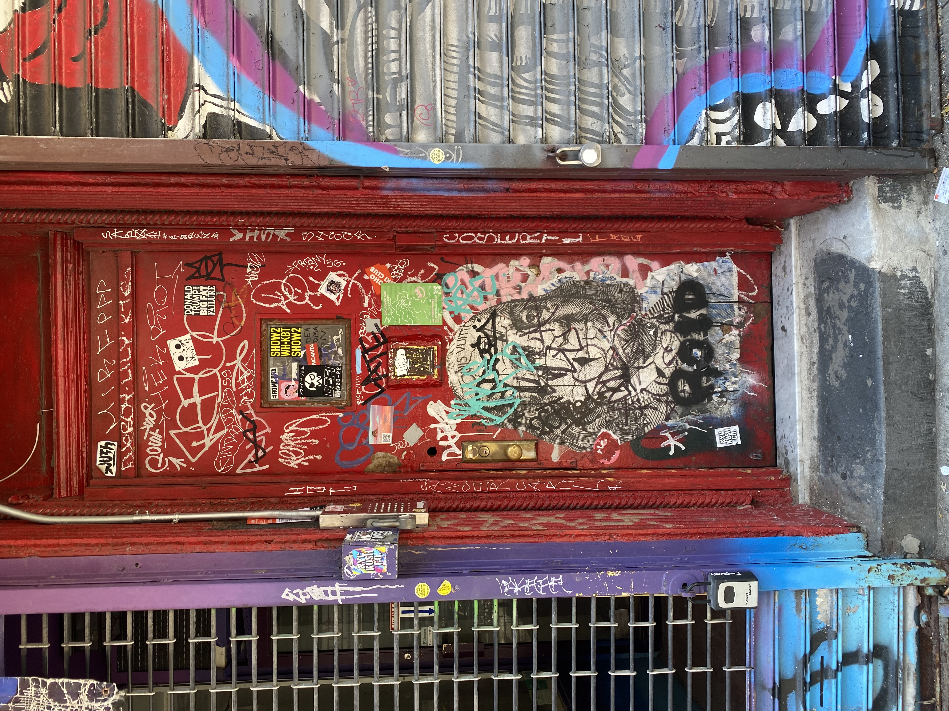 Tall arched Art Deco window with decorative metalwork — London